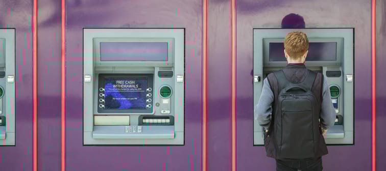 Man withdrawing cash from a cash machine (ATM)