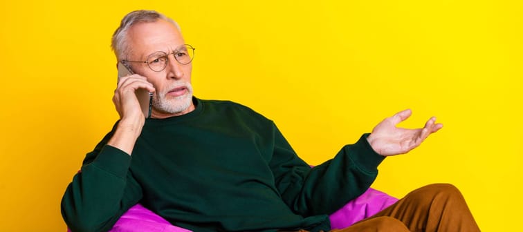 Photo portrait of retired man on the phone