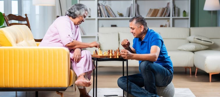 Elder couple playing chess