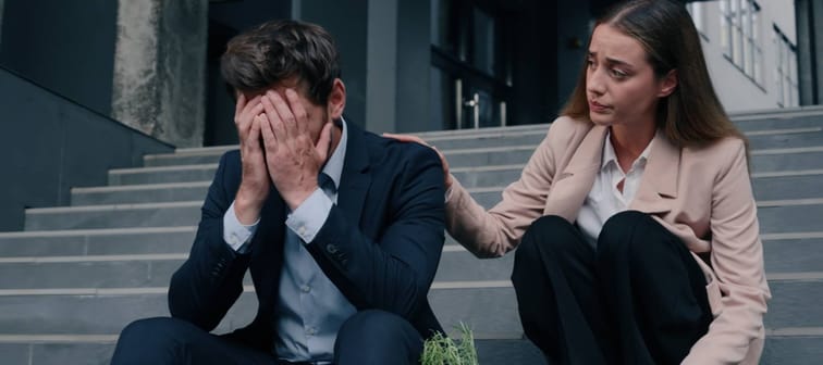 Woman consoling male