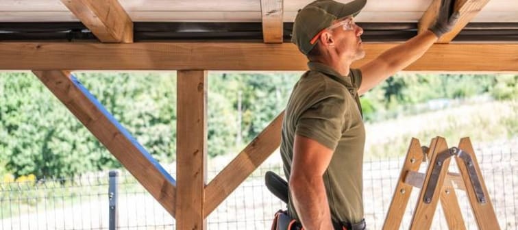 Construction worker building roof