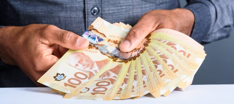 Person holding Canadian bills