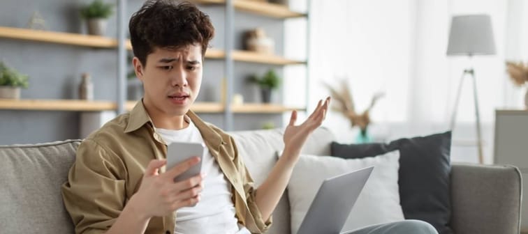 Man looking shocked at his phone