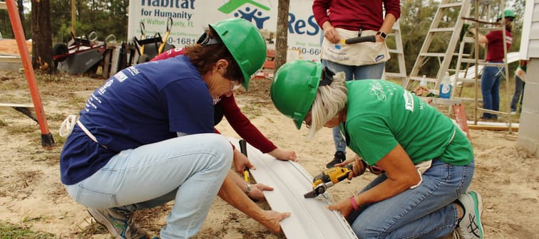 Two women building home