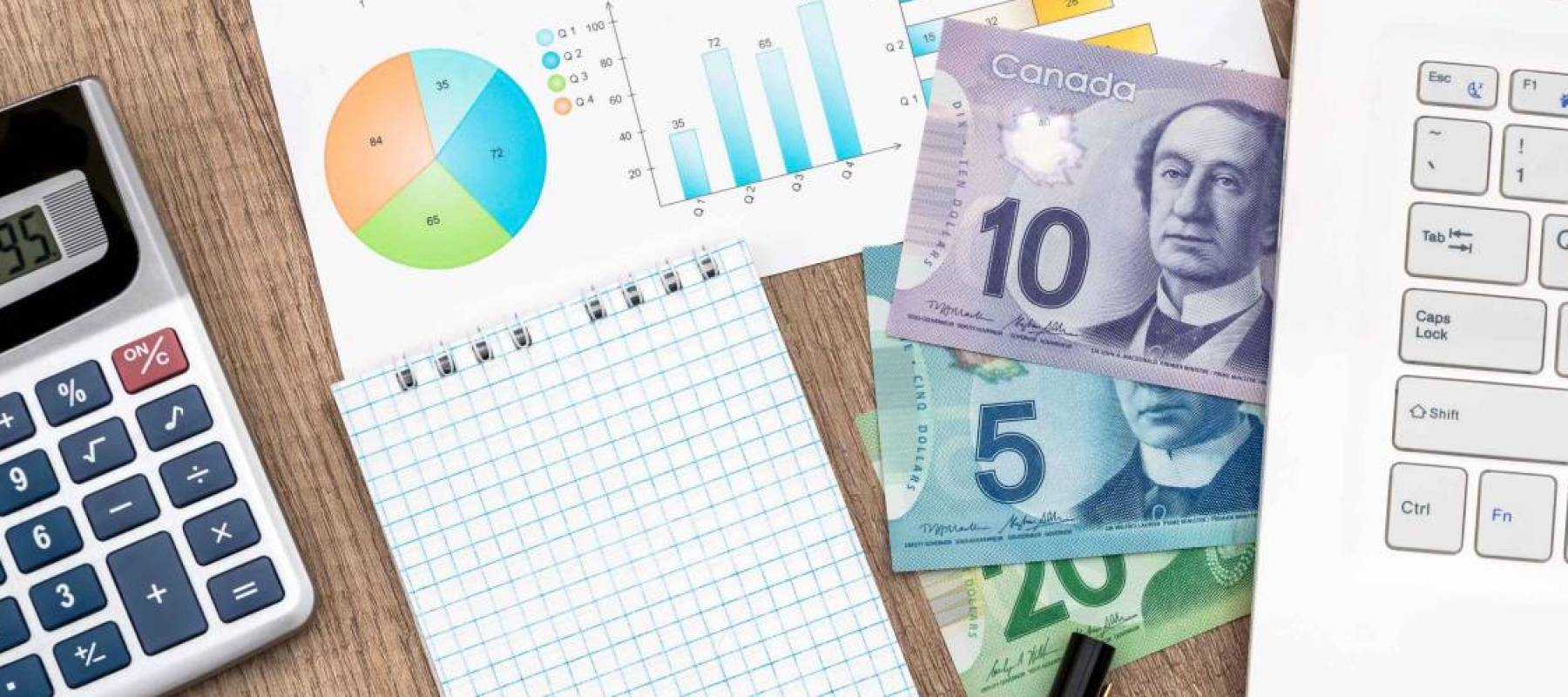 Canadian Dollar Notebook Money And Calculator On The Table